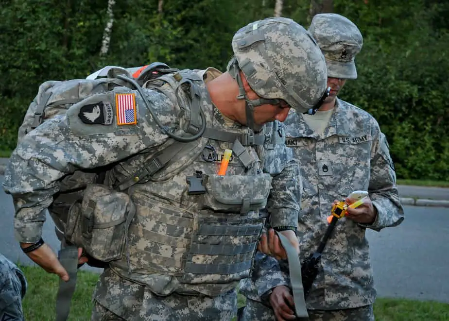 Staff Sgt. Devin Allred straps his ruck sack in preparation for the ruck march event of the U.S. Army 