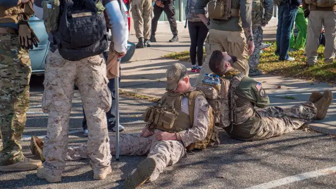 Soldiers sleeping in a seated position