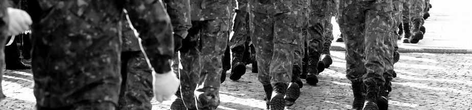 Close up photo of soldiers' feet while they ruck march