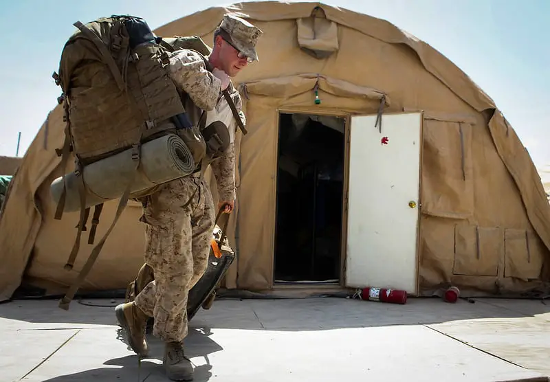 Corporal Jeffery Mount, from Hendersonville, Tennessee, team member, Security Force Assistance Advisor Team 2-215, moves his gear in preparation to leave Forward Operating Base Nolay, Helmand province, Afghanistan, May 2, 2014. Mount, along with the rest of SFAAT 2-215, are completing a seven-month deployment to the area as the last advisors in support of the 2nd Brigade, 215th Corps, Afghan National Army.