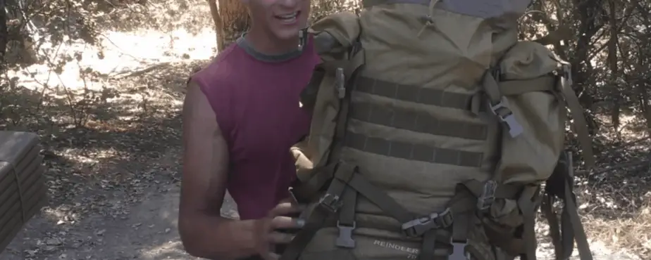 man holding the Wisport Reindeer 75L Rucksack