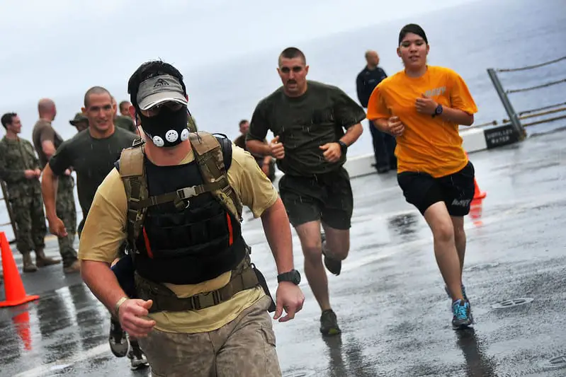 man running with a weighted vest