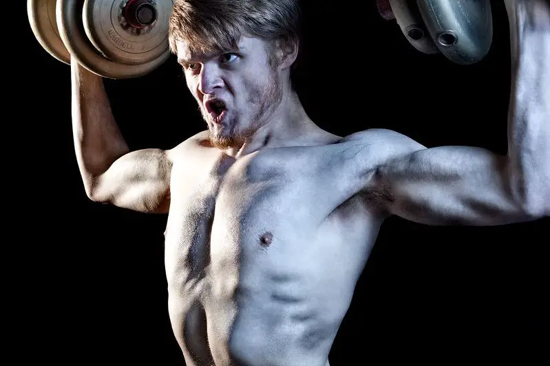 Billy Wilson performing the shoulder press exercise