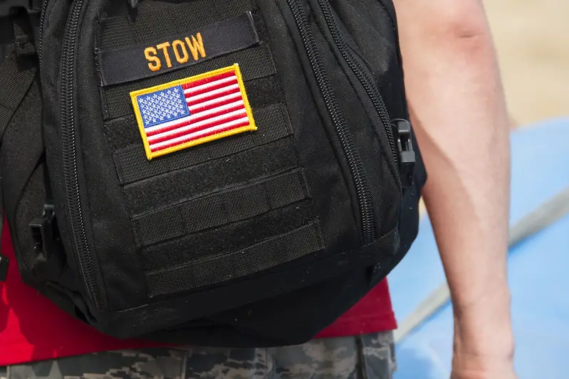 close up shot of a ruckers rucksack with a view of his rucksack patch.